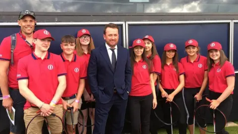 Graeme McDowell with litter pickers at The Open
