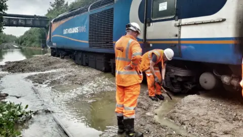 British Transport Police Workmen at site of stranded train