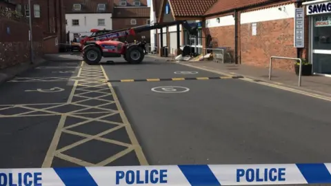 BBC The digger left at the scene