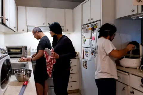 Miguel Carrion Miguel's family cooks in the kitchen