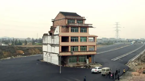 AFP House in the middle of a newly-built road in Wenling, in eastern China's Zhejiang province