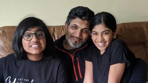 Sital Punja Anand Punja and his daughters