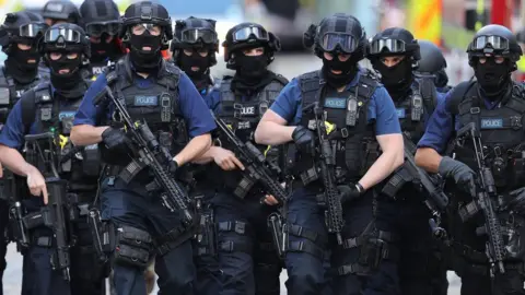 Getty Images Counter terrorism officers march near the scene of the London Bridge terrorist attack, 5 June 2017