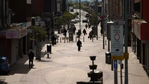 Getty Images An almost deserted high street in Rhyl, Denbighshire during lockdown