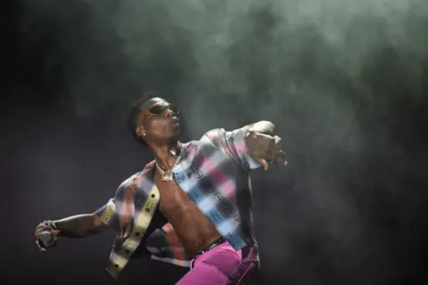 Gian Ehrenzeller/EPA Wizkid performs at Openair Frauenfeld music festival in Switzerland.