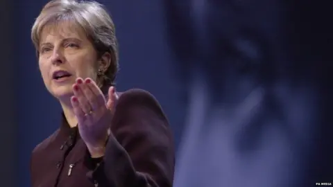 PA Media Theresa May addressing the Conservative Party conference in 2002