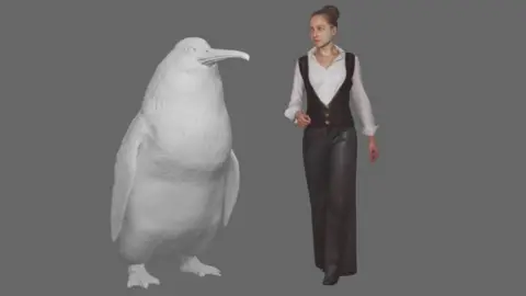 Canterbury Museum A model of the penguin standing next to a woman for scale