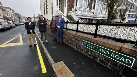 Parish of St Helier St Helier Roads Committee members: Jason Lagadu, Mario Pirozzolo and Heather-Ann Hubbell. With Constable Simon Crowcroft on Cleveland Road