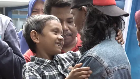 UNICEF Fikri and his dad when they were reunited