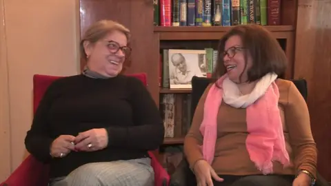 Two women laughing with eachother