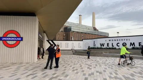 Battersea Power station in the background, new Tube station in the foreground