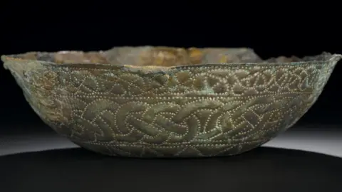 NAtional Museums Scotland Bowl of silver, decorated with four pairs of grotesque animals, interlocking, Pictish, from St Ninian's Isle, 8th century.jpeg