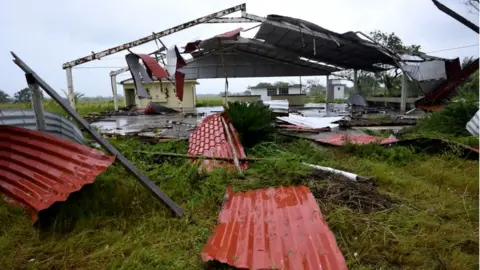 Reuters A damaged building, which had been out of use, is seen after Hurricane Grace slammed into the coast with torrential rains, in Costa Esmeralda, near Tecolutla, Mexico, 21 August 2021