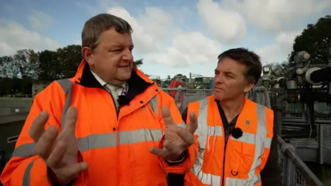 Tony Jolliffe/BBC Steve Wilson of Welsh Water and Jonah Fisher of BBC NEWS