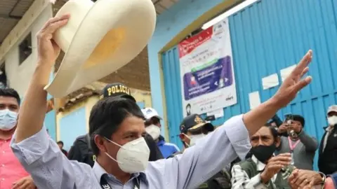 EPA Peruvian presidential candidate Pedro Castillo (C) from the Peru Libre party arrives to vote in the town of Tacobamba, Cajamarca department, Peru, 11 April 2021