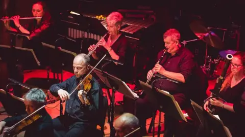 Newsight Photography People in the orchestra playing musical instruments