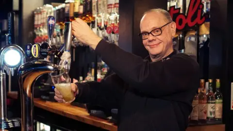 Mark Oakley in his bar