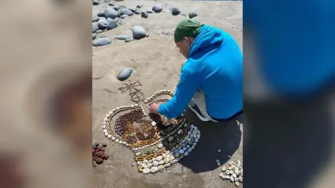 Beach4Art A photo of the pebble crown being created