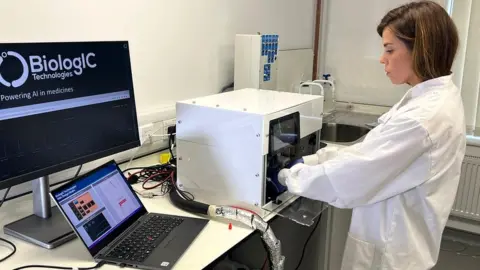 Scientist working with a medicine machine at Biologic