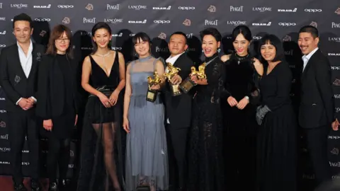 AFP The cast of The Bold, The Corrupt and The Beautiful pose with their awards at the Golden Horse Film Awards