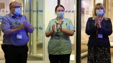 Reuters NHS workers clap at Chelsea and Westminster Hospital