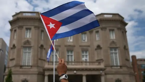 Getty Images A Cuban flag waved in front of the embassy in Washington DC