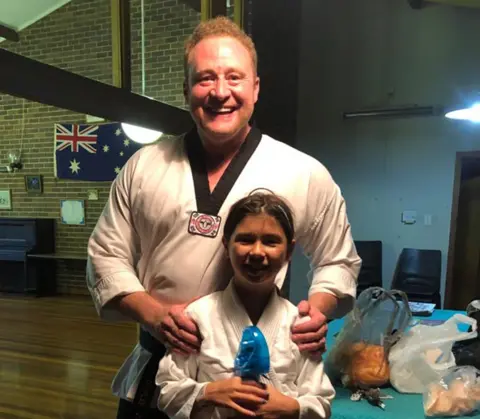 Charles Carter  Charles with his daughter in martial arts uniform