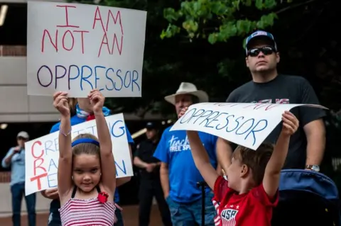 Getty Images Children attend a protest in Virginia