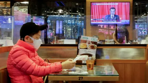 Reuters NPC on TV in Hong Kong