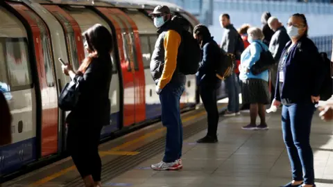 Reuters Commuters at Canning Town underground station in east London