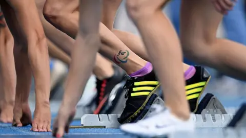 Getty Images Athletes on a track