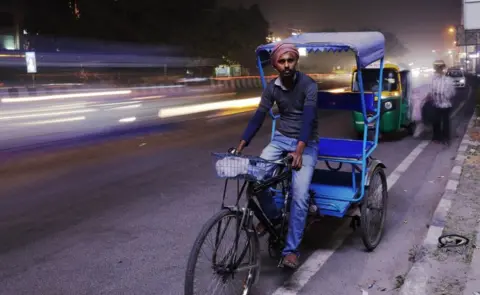 Ankit Srinivas Jai Chand Jadhav on his rickshaw