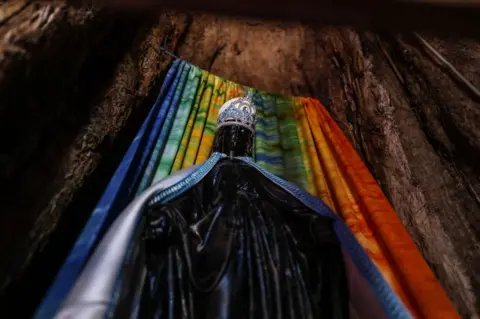 Getty Images A view of the statue of the Virgin Mary inside of the Mariam Dearit shrine on January 02, 2023 in Keren, Eritrea. Mariam Dearit is a Shrine or church named for the Virgin Mary and is constructed in the trunk of a 500 year old, 75 foot baobab tree. The site which is just two kilometres outside of the city of Keren is a destination for devout pilgrims of all faiths