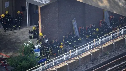 Getty Images Firefighters resting