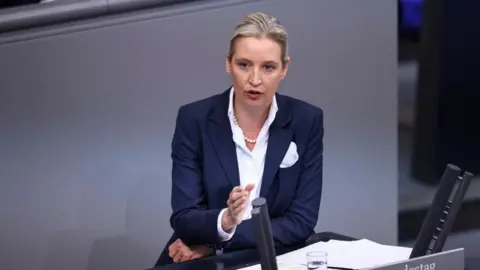 Reuters Alice Weidel, co-leader of the Alternative for Germany party (AfD), speaks on the day German Chancellor Olaf Scholz delivers a government declaration on the budget situation to the lower house of parliament Bundestag in Berlin, Germany, November 28