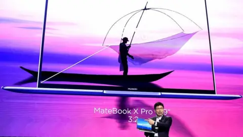 Getty Images Richard Yu and Huawei laptop