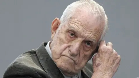 AFP In this file picture taken on April 20, 2010, former Argentine de facto president and Army chief Reynaldo Bignone gestures at the courtroom before being sentenced during his trial, in Munro, Buenos Aires