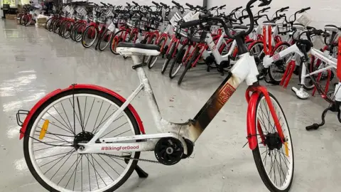 One of the damaged red and white biked