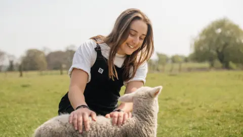 Anna Jackson Anna Jackson with a lamb