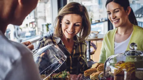 Getty Images Women in coffee shop