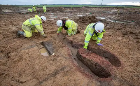 MOLA Archaeologists excavating the Roman kiln found at Field 44 on the A428