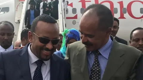 Fitsum Arega/Twitter President Isaias Afewerki puts his arm around Prime Minister Abiy Ahmed