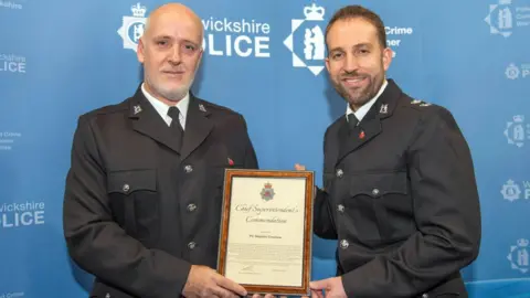 Warwickshire Police PC Croshaw, pictured with Chief Superintendent Ben Smith