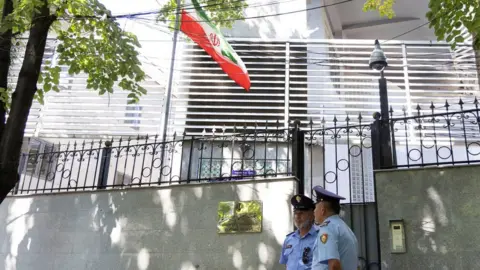Reuters Albanian police stand outside the Iranian embassy in Tirana, Albania (7 September 2022)