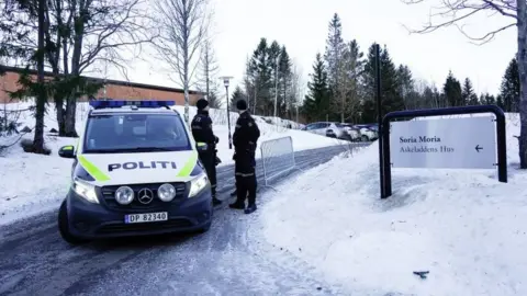 Reuters Police guard a road leading to the hotel outside Oslo