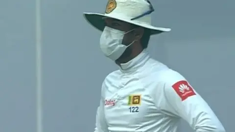 Sky Sports Sri Lanka captain Dinesh Chandimal wearing a mask while fielding against India in Delhi