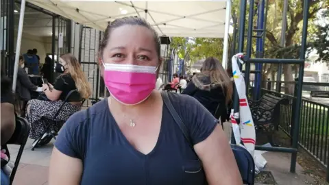 María González poses for a photo after getting vaccinated