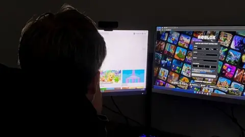 BBC Boy playing Roblox on computer