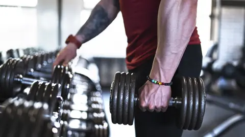 Getty Images Man working out in gym