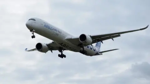 Getty Images An Airbus A350-1000 conducts a test flight over Chateauroux airport, central France.